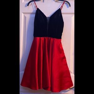 A mini black velvet (top) and red satin dress (bottom).